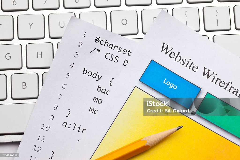 Website designing Wireframe for website on keyboard with pencil. Backgrounds Stock Photo