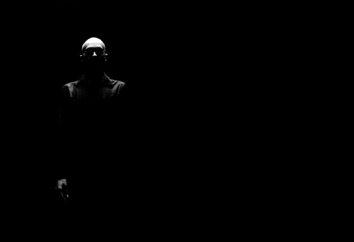 Bald headed man lurking in the shadows. Canon 1Ds Mark 2 file