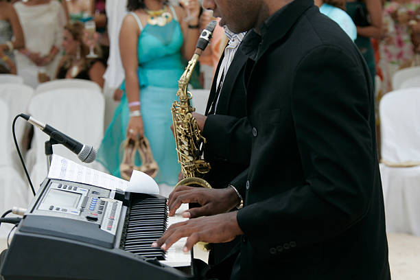 istock Musician entertaining group of people in a ball 184097242