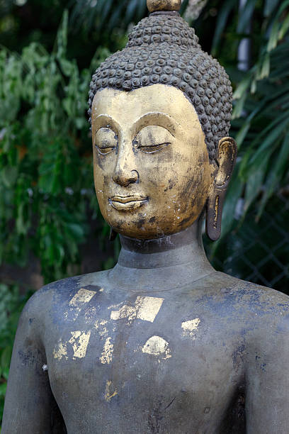 Buddha image with gold leaf applied stock photo