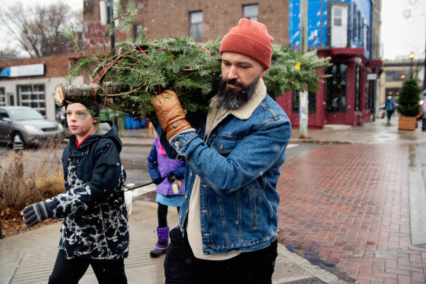 istock Urban family bringing home a Christmas tree. 1840976661