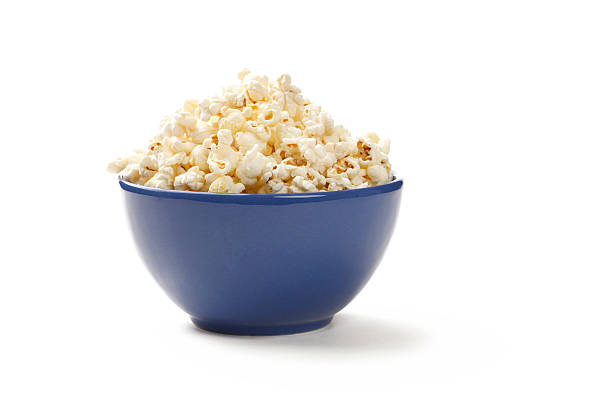 Popcorn A bowl of popcorn isolated on white bowl stock pictures, royalty-free photos & images