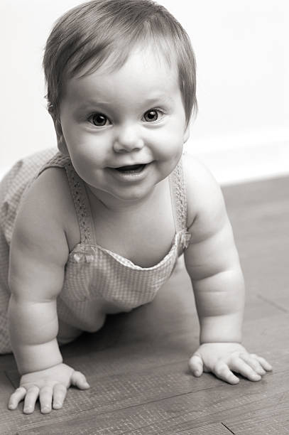 istock Happy Baby Learning to Crawl - Black & White 184098817