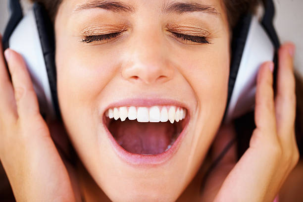 istock Young woman enjoying loud music 184098957