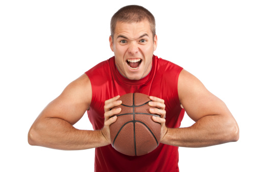 Studio shot of a handsome young basketball player