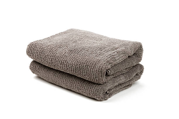 Two folded gray towels stacked together stock photo