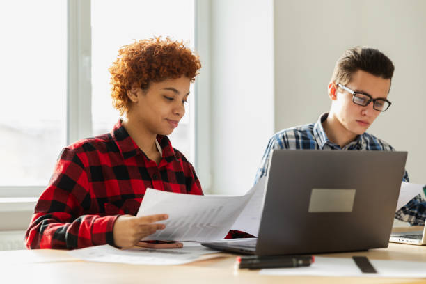 istock Diverse colleagues business people working on office. Startup business group working as team to find solution to problem. Happy multiracial corporate professional team discussing project ideas. 1840996308