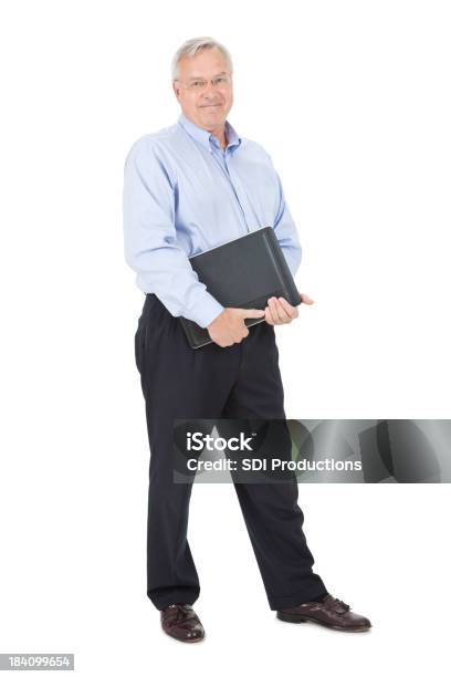 Happy Mature Adult Man With Laptop And Work Binder Stock Photo - Download Image Now - Businessman, 50-59 Years, 60-69 Years