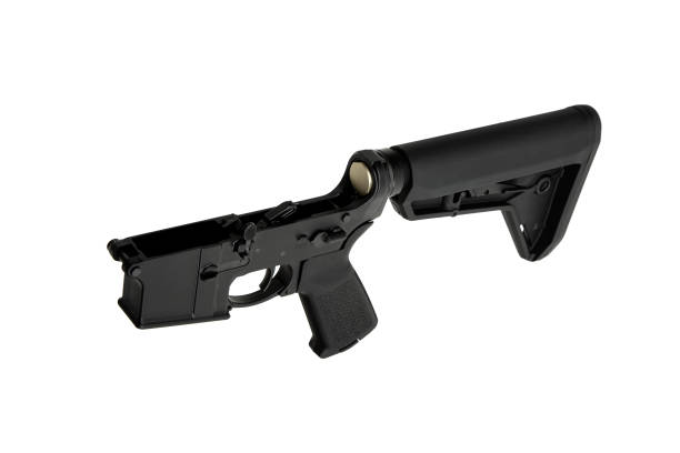 istock AR15 lower receiver iand buffer spring. Bottom half of a modern assault rifle. Isolate on white background. 1840998023