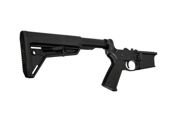 istock AR15 lower receiver iand buffer spring. Bottom half of a modern assault rifle. Isolate on white background. 1840998026