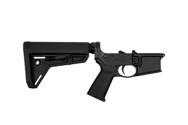 istock AR15 lower receiver iand buffer spring. Bottom half of a modern assault rifle. Isolate on white background. 1840998066