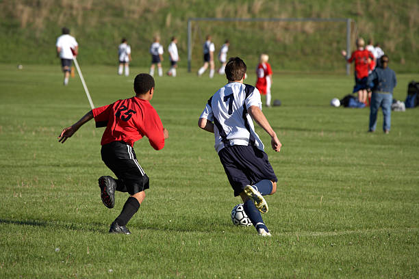 istock Players going for the ball 184100044