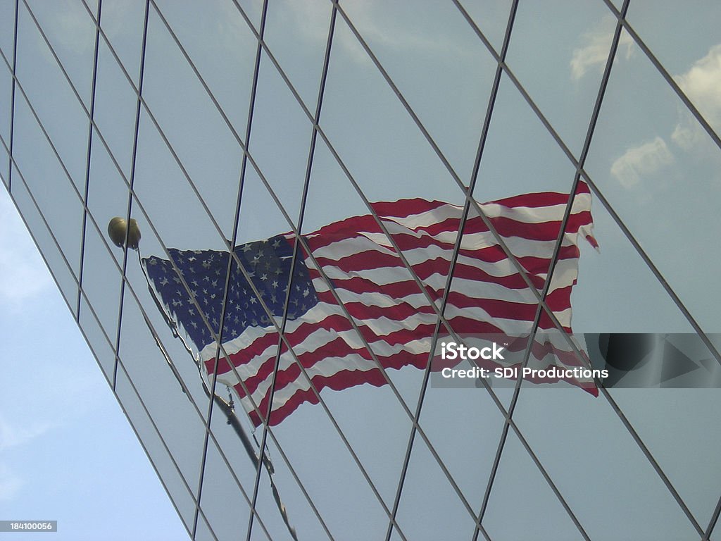 Flag Reflecting in an angled office building "Flag Reflecting in an angled office building. To see my full collection of buildings and reflections, click on the photos below:" American Flag Stock Photo