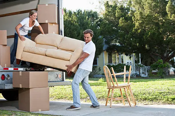 Photo of Young couple moving house