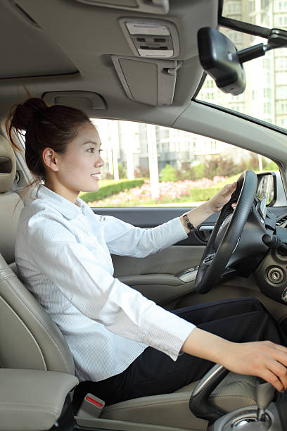 istock Smiling businesswoman drive a car 184100370