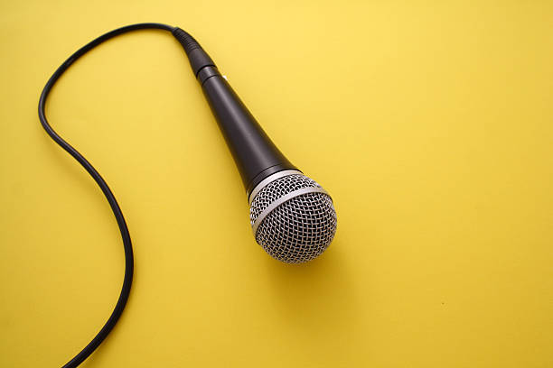 Microphone on orange background  media interview photos stock pictures, royalty-free photos & images