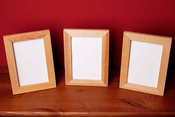 Three frames "Three frames with blank spaces on a sheld, and cherry painted wall.Blank spaces Lightbox:" three objects photos stock pictures, royalty-free photos & images