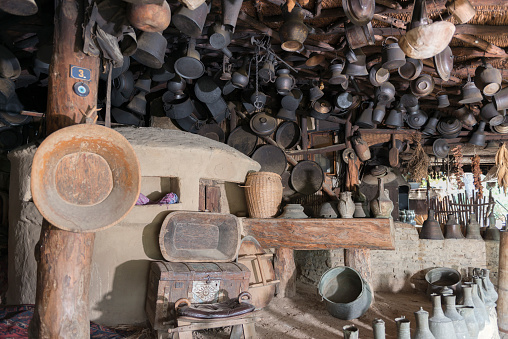 Ancient metal jugs in oriental style in antique market.