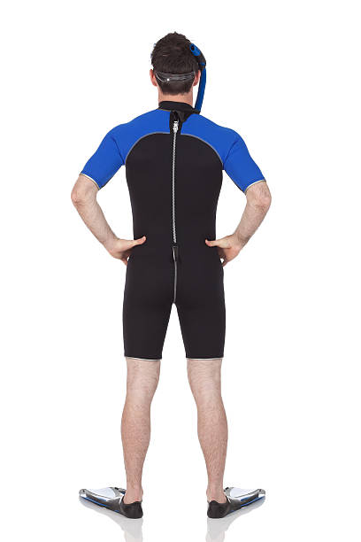 istock Rear view of a man standing in scuba gears 184101290