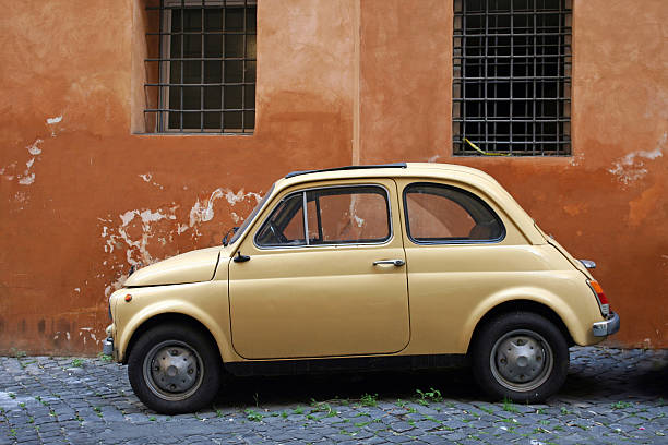 istock Small yellow vintage car in Rome 184101997