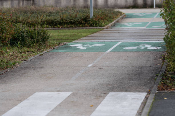 istock Road with zebra, bicycle path signs and tramway rails. 1841020342