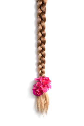 Natural blonde braided hair with flower on white background