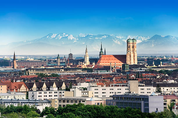 Munich Munich, capital city of Germany's Free State of Bavaria. CIty skyline in the evening light. The Alps visible in the background. munich photos stock pictures, royalty-free photos & images