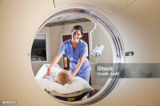 Healthcare Worker Preparing Patient For Ct Scan Stock Photo - Download Image Now - Covering, Nurse, Female Nurse