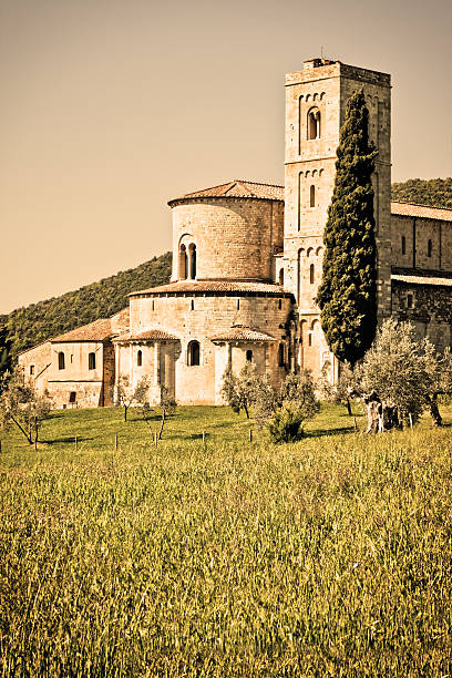 Exterior view of the Sant'Antimo church in the Val d'Orcia (Tuscany, Italy). The monastic complex is one of the most important Tuscan Romanesque architecture.