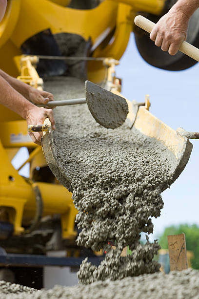 istock Concrete from Cement Mixer Trough for Sidewalk 184102849