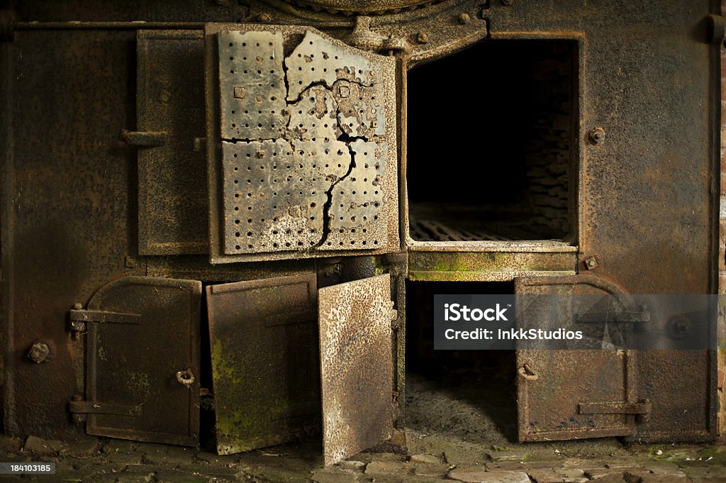 Steam Engine Firebox Old Steam engine firebox used in an old wool mill. Backgrounds Stock Photo