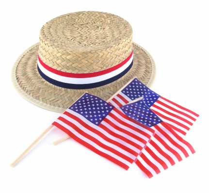 A straw election hat with three American flags.