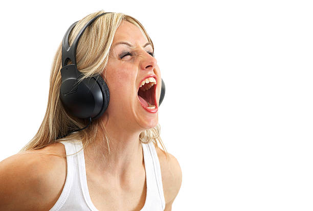 istock Woman screaming with headphones 184103850