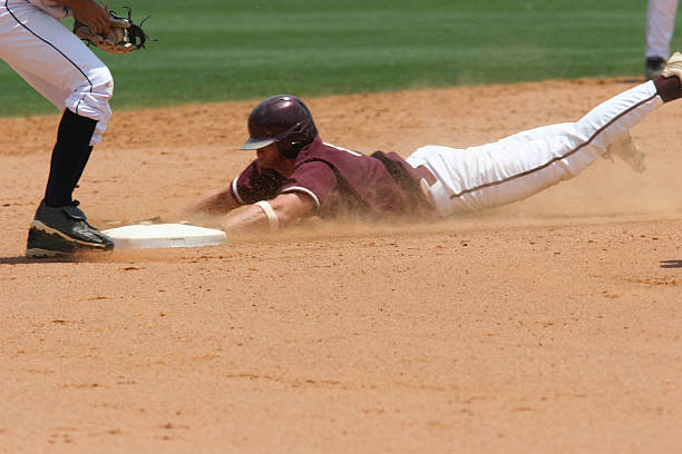 istock A baseball player sliding to the plate 184104159