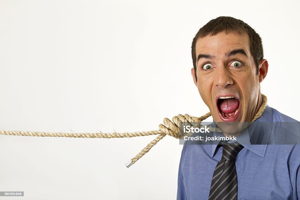Business man caught with a rope A young businessman gets caught by a rope and doesn't like it; employment and job concept.Similar choices below: Adult Stock Photo