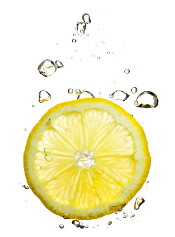 Picture with water drops, splashes and fruits. White isolated background crystal clear liquids.