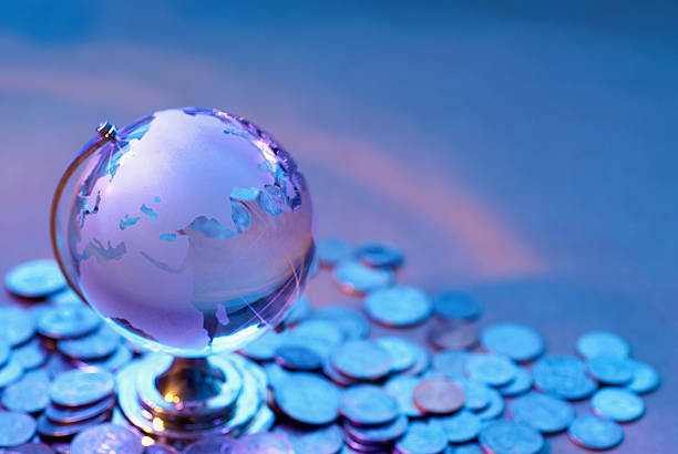 istock Glass World and coin 184104439