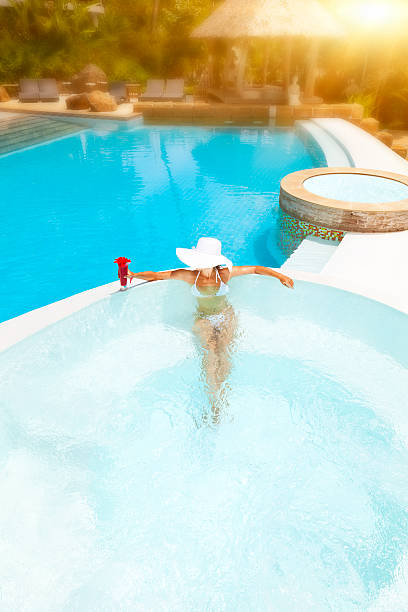 istock woman relaxing in waterpool 184105256