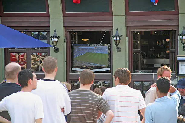 A crowd of people watching the football world-mastership in germany.
