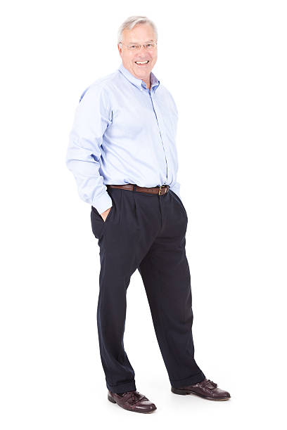 istock Happy Mature Business Man Standing With Hands in Pockets 184106024