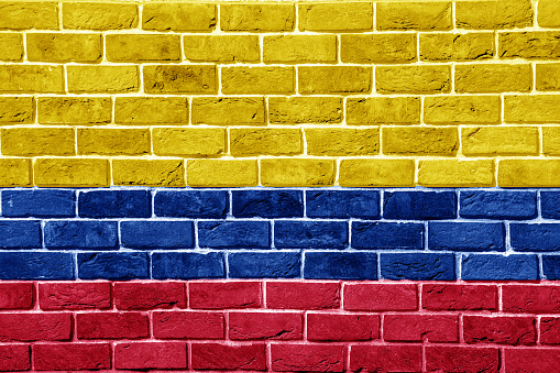Flag of Republic of Colombia on a textured background. Concept collage.
