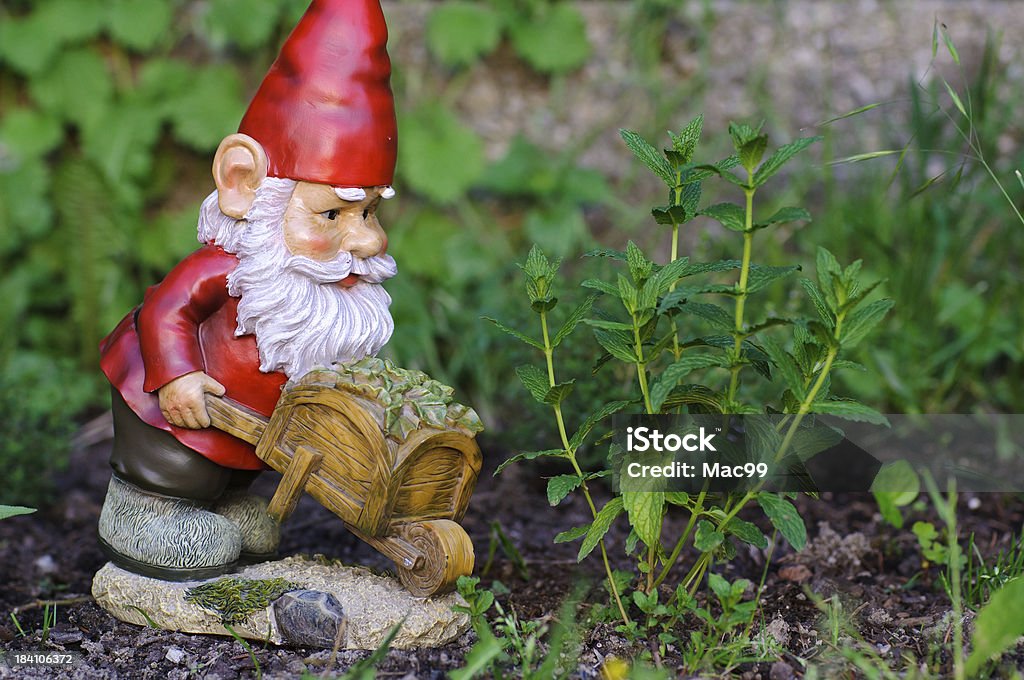 Garden Gnome working Gnome Stock Photo