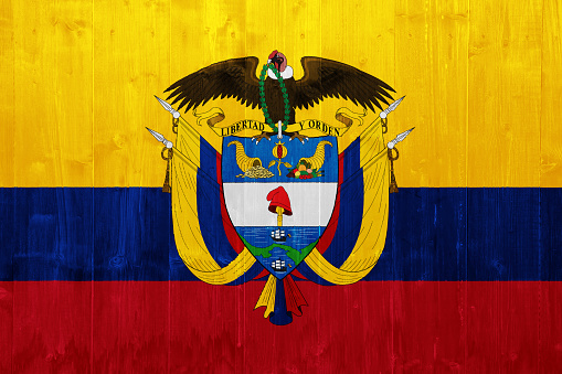 Flag and coat of arms of Republic of Colombia on a textured background. Concept collage.