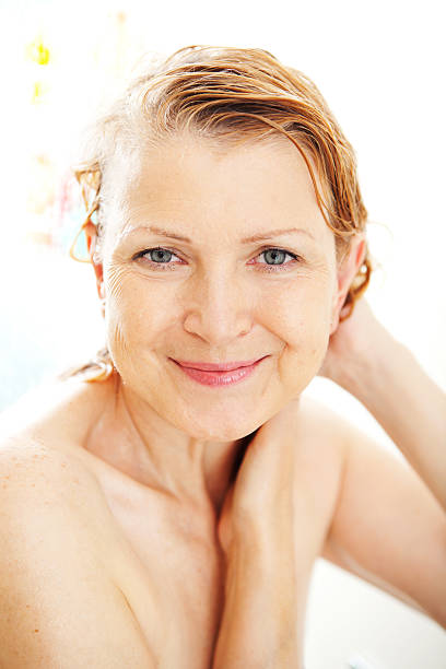 istock Mature woman taking shower. 184106509