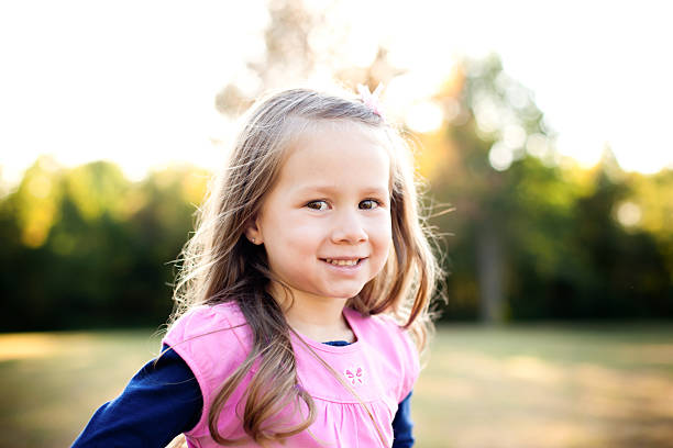 istock Happy Super Cute Little Girl Smiling at Camera 184107042
