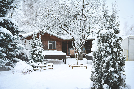 Winter landscape. Large country house on a sunny winter day.