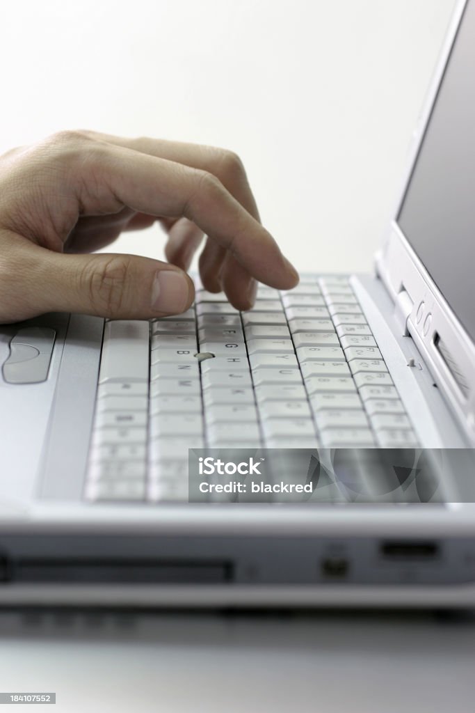 login Close up of a hand typing on laptop keyboard.Similar images - Accessibility Stock Photo