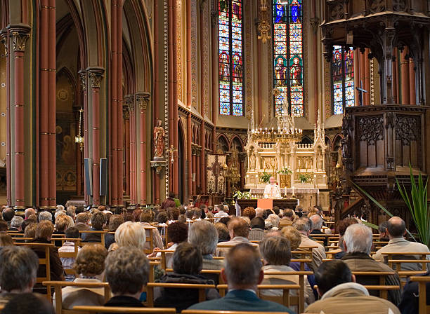 European church service "Full church, with Roman Catholic service.Location: Belgium." churches stock pictures, royalty-free photos & images