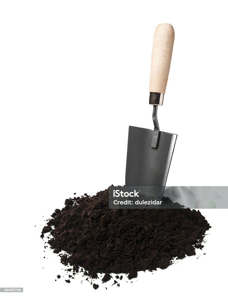 Gardening Gardening spade in soil isolated on white Black Color Stock Photo