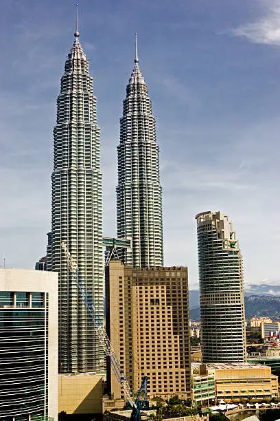 "petronas twin towers in kuala lumpur malaysia, sunny day, blue sky. cityscape from above."